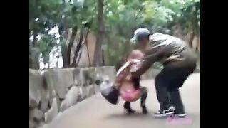 Asian babe falls to the ground during skirt sharking